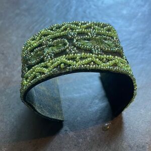 VINTAGE 2005 weird green beaded cuff bracelet
Everyone was wearing green